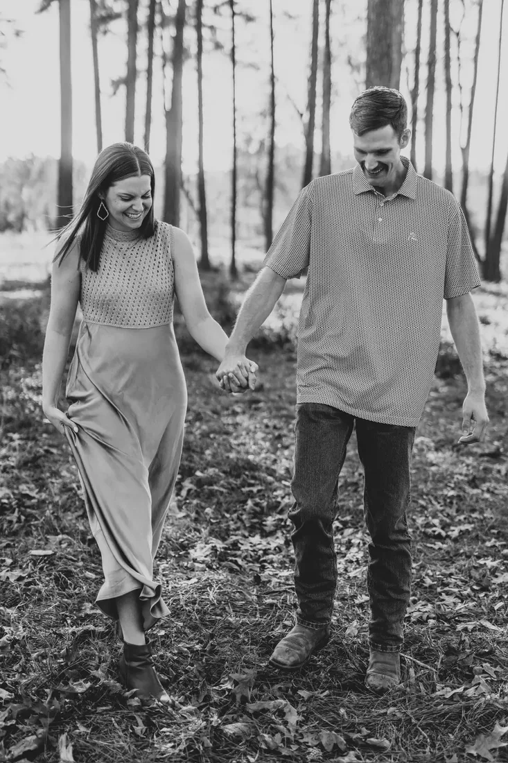 Engagement session, couple walking hand in hand, black and white